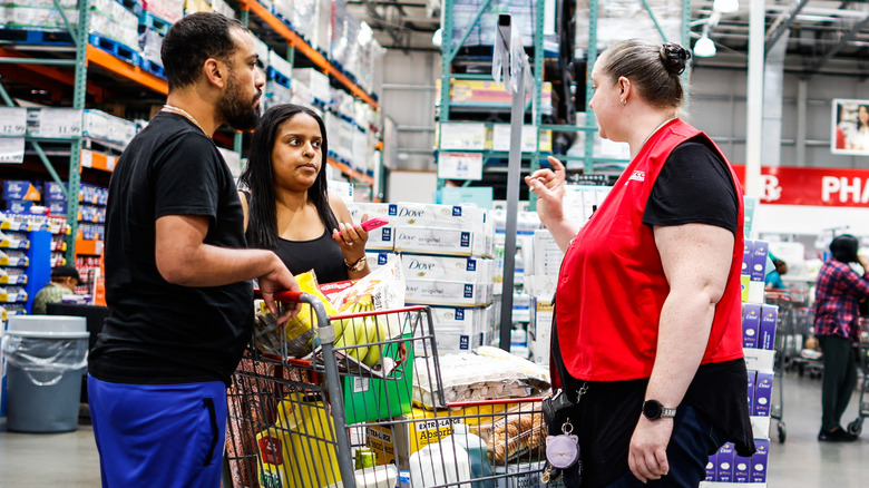 customers and employee at Costco