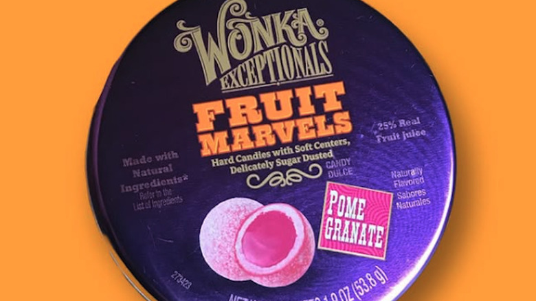 Three boxes of Wonka Fruit Marvels, with the fruit candy in front of  each one