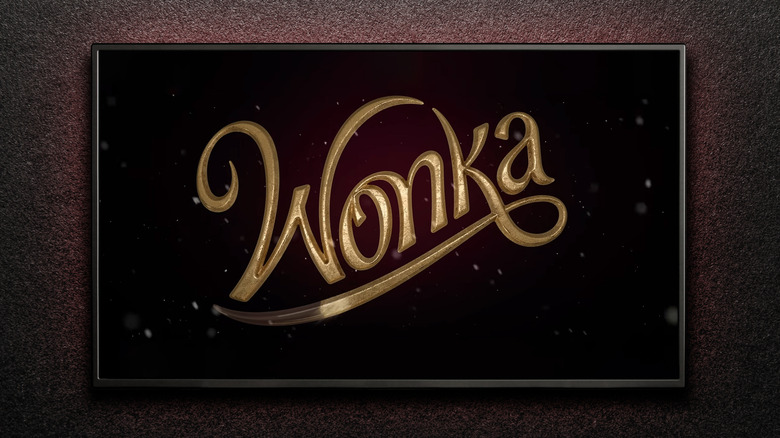 The word Wonka written in gold, on a dark plaque background