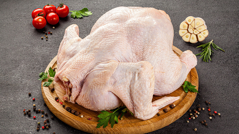raw turkey on cutting board