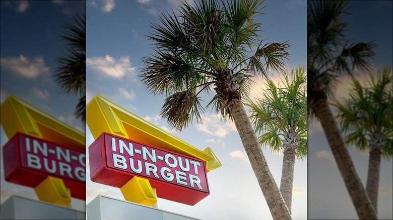 In-N-Out sign with crossed palms
