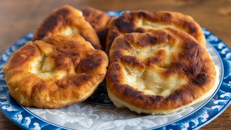 Fresh frybread on a blue and white plate