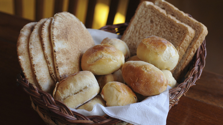 a selection of breads in a wicker basket