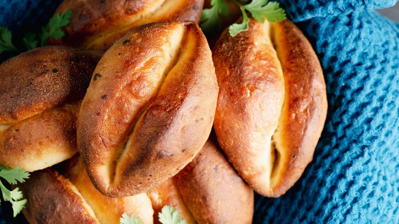 A close up of six Parker House Rolls