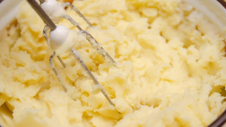 beating mashed potatoes with hand mixer