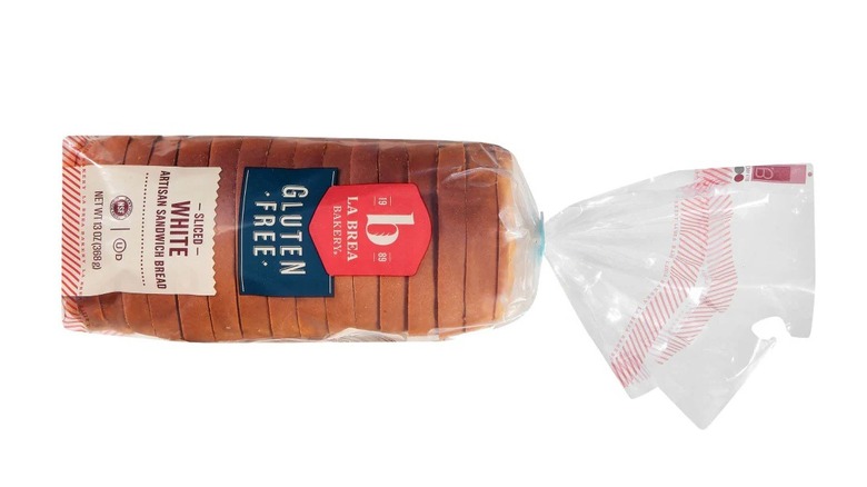 A bag of La Brea Bakery's gluten free white bread on a white background