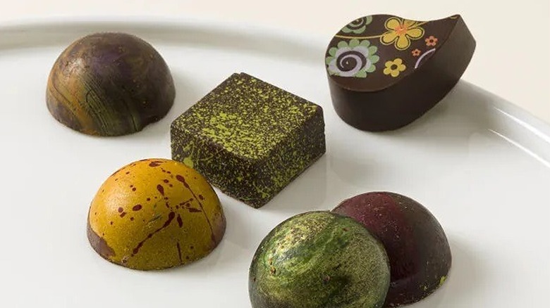 A close up of chocolates from Uncommon Goods' Spices of the World Chocolate Truffle Collection