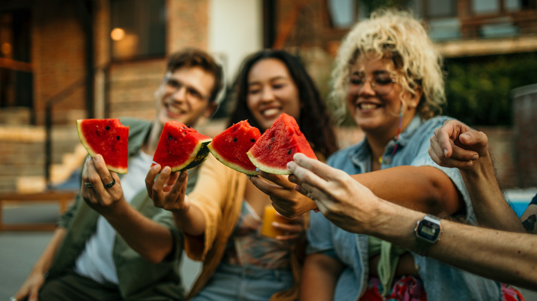 friends eating watermelon