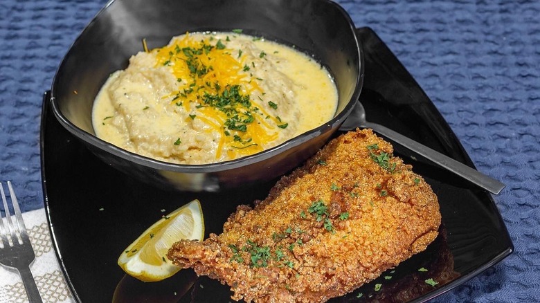Plate with fried catfish and grits 
