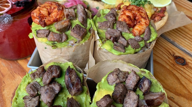 Two meat and shrimp burritos