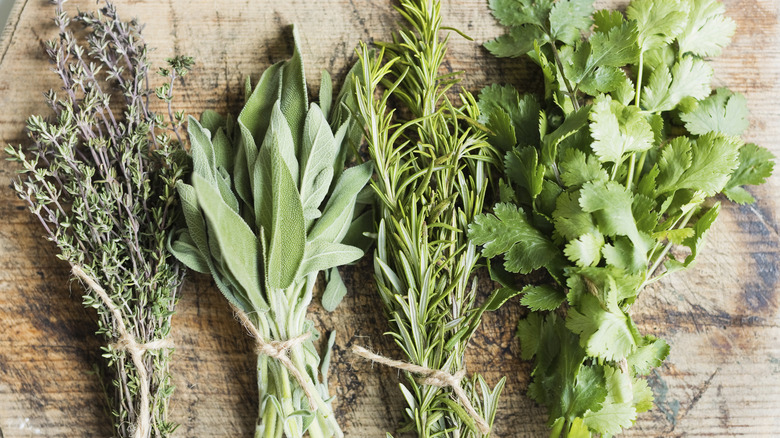 fresh herbs on cutting board