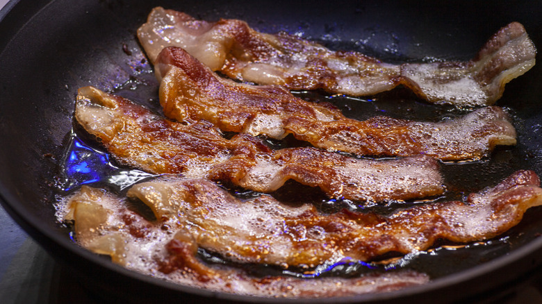 bacon frying in a pan