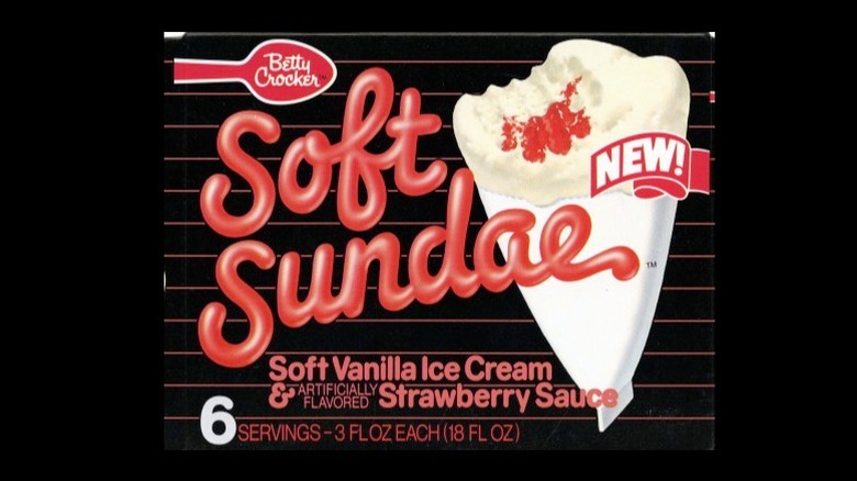 A box of Betty Crocker Soft Sundaes with strawberry flavored sauce on a black background