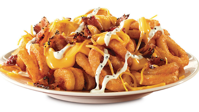 a close-up of a plate of Arby's loaded curly fries