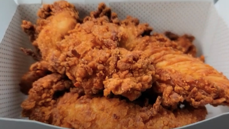 A close-up on a box of chick-fil-a chicken strips