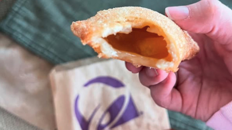 taco bell's caramel apple empanadas in person's hand