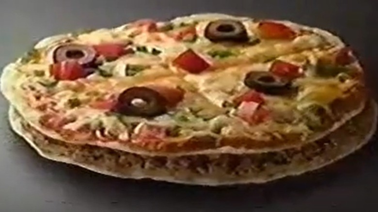 a still from an advert about Taco Bell's Mexican pizza