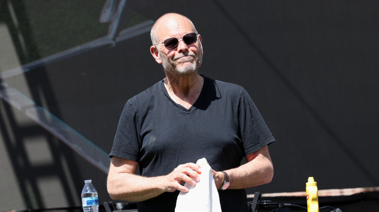 Alton Brown smiling in sunglasses