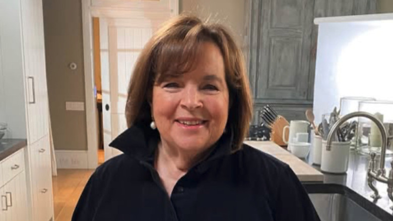 Ina Garten smiling at camera in her kitchen