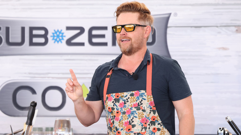 Richard Blais addressing an audience with pointed finger