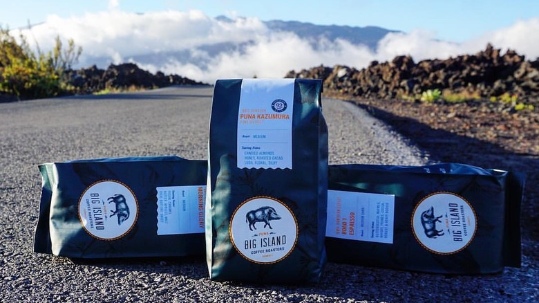 Closeup of bags of Big Island Coffee Roasters coffee on Hawaiian road.