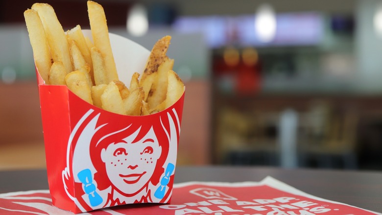 Wendy's box of fries on table in restaurant