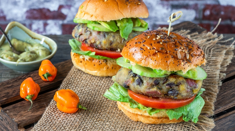 two black bean burgers on burlap