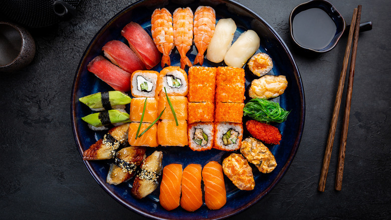 A plate with different types of sushi