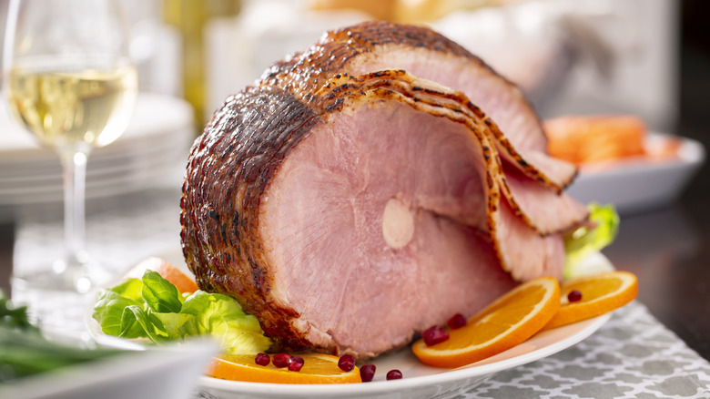 A succulent sliced ham on a holiday platter