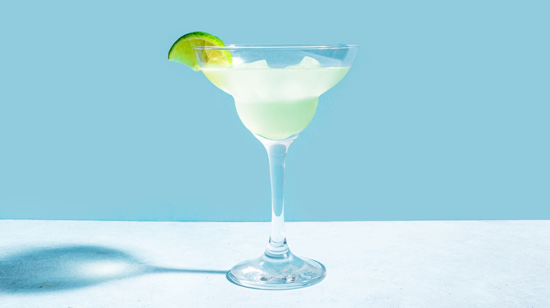 Margarita with lime wedge in glass