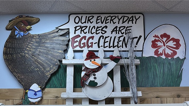 A refrigerated display in Trader Joe's. The sign says says "Our everyday prices are egg-cellent!"