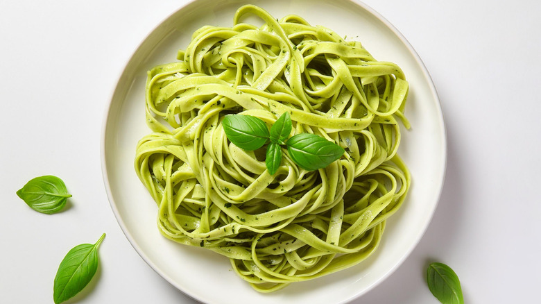 Spinach fettuccine overhead view on white plate