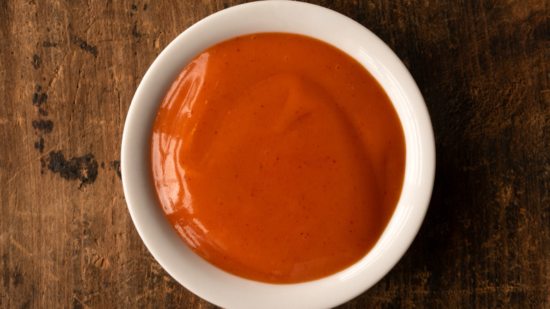 A small bowl with buffalo sauce