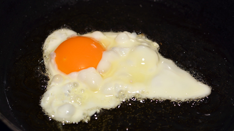 Frying an egg with ghee