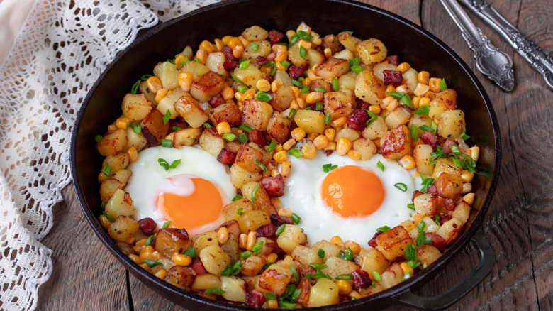 Hash browns and fried eggs in a skilet