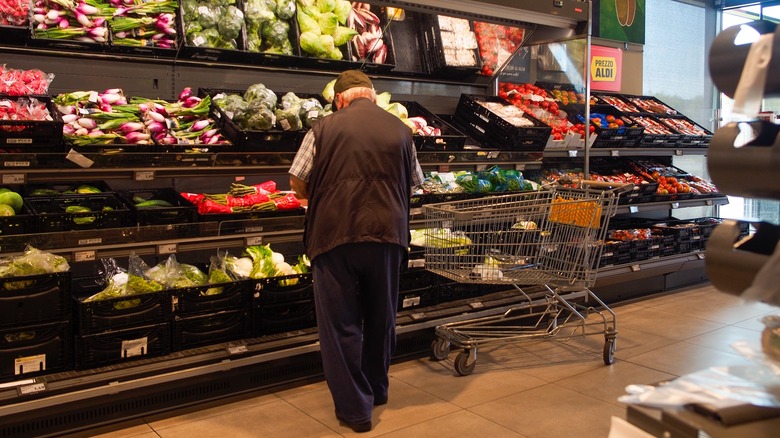 Person shopping for produce in Aldi