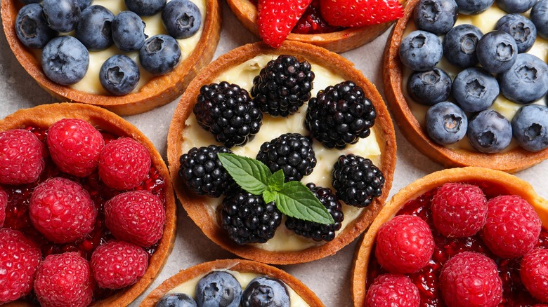 mini fruit tarts topped with berries