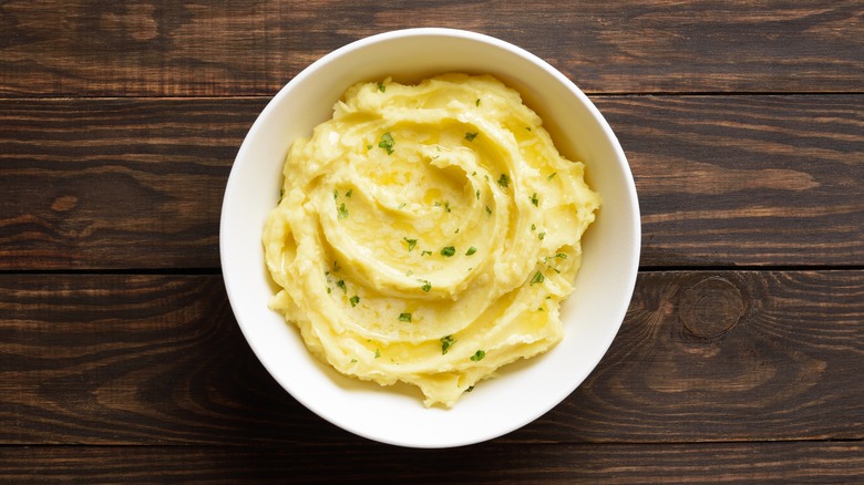 Creamy mashed potatoes in white bowl