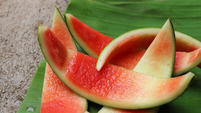 cut watermelon rinds on a leaf