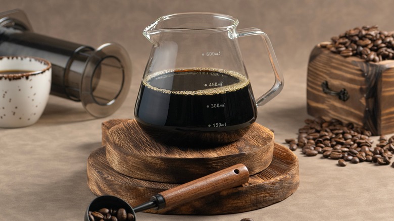 Carafe with coffee and AeroPress coffee maker