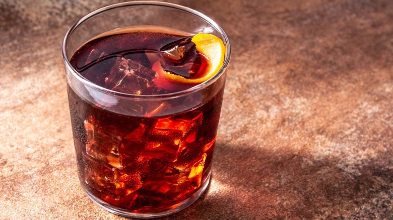 Boulevardier in glass with ice and orange peel