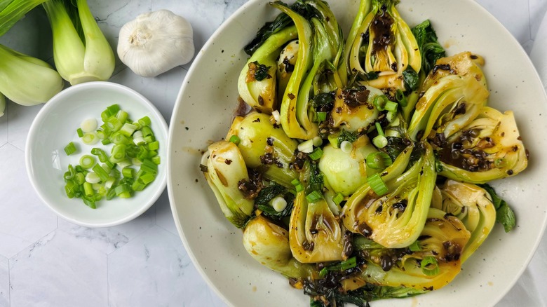 cooked bok choy in a white bowl