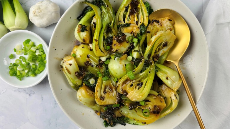 cooked bok choy in a white bowl