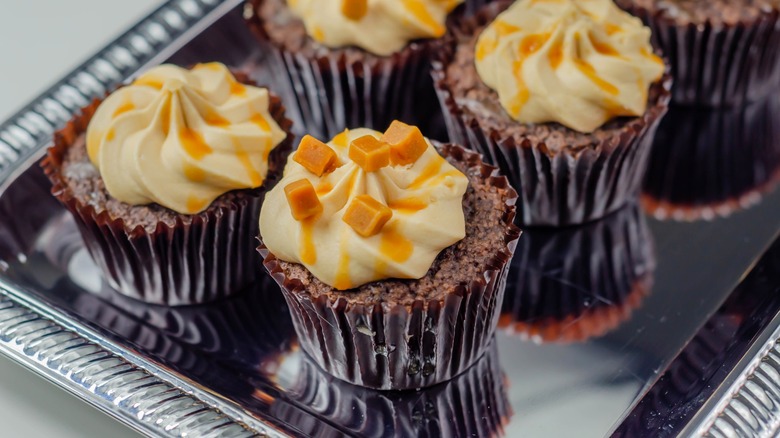 Chocolate cupcakes with Baileys flavored frosting and caramel drizzle