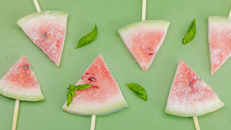 Wedges of frozen watermelon with basil