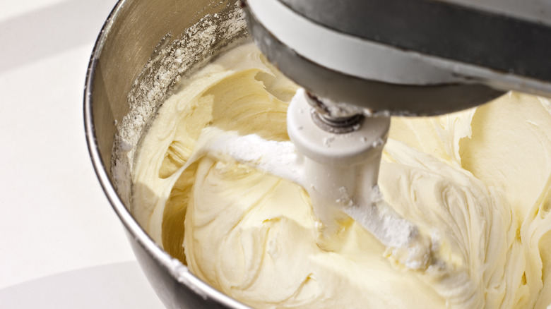 mixing frosting with electric mixer