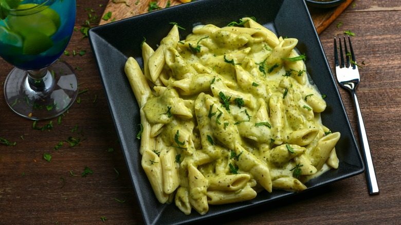 spinach pasta plated on table