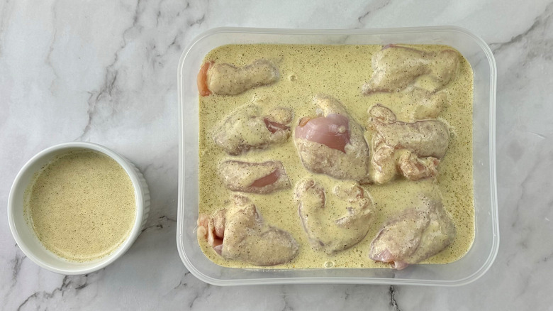 chicken in greenish-beige liquid