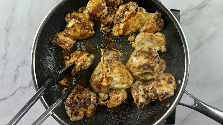 cooked chicken in frying pan