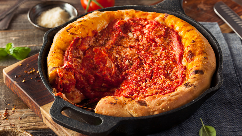 Deep dish pizza on a cast iron skillet